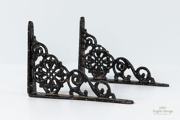 Small black cast iron decorative brackets
