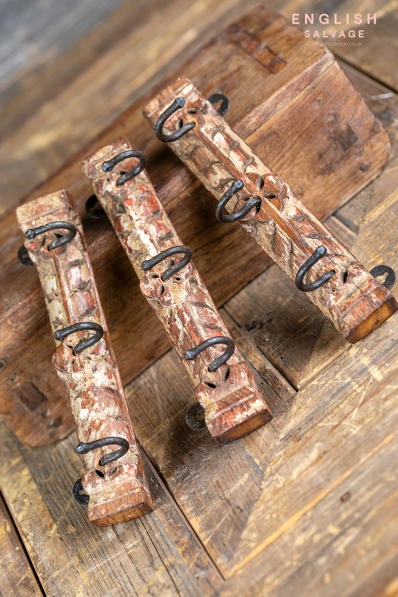 Small hooks on old carved wood