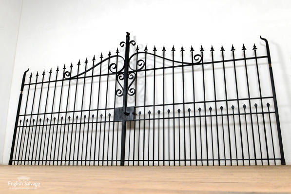 Striking black iron driveway gates 