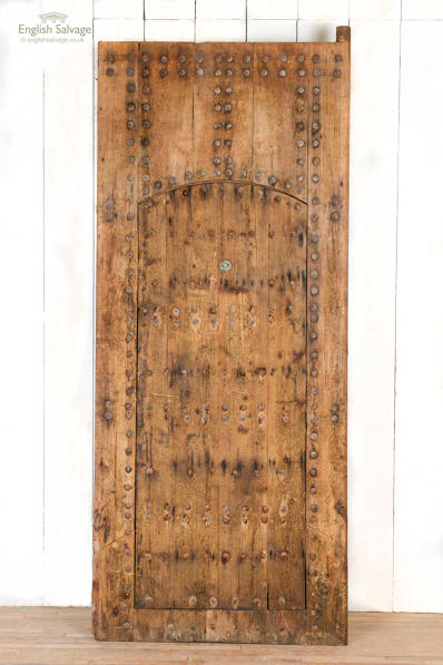 Studded Moroccan plank door with Judas gate