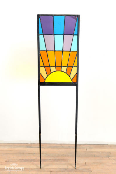 Sunburst stained glass on metal stakes