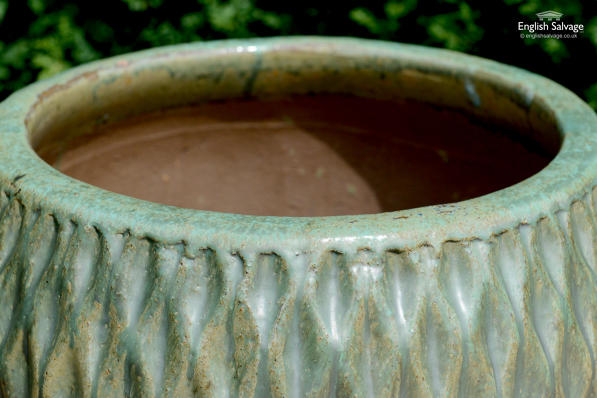 Textured terracotta pots with green glaze