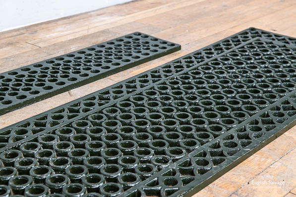 Two sizes of long cast iron grilles / grating