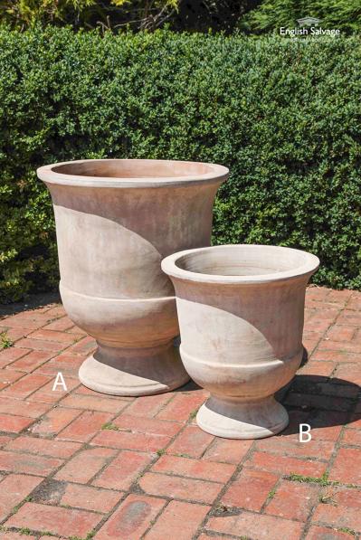 Two sizes of round terracotta plant pots