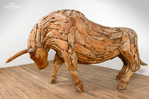 Unusual teak sculpture of pawing bull