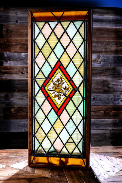 Victorian stained glass with bird panel