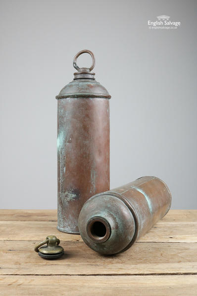 Vintage copper water carriers from a car