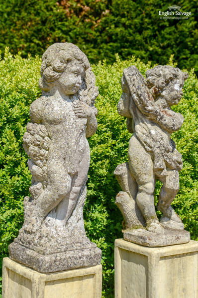 Weathered composition stone putti