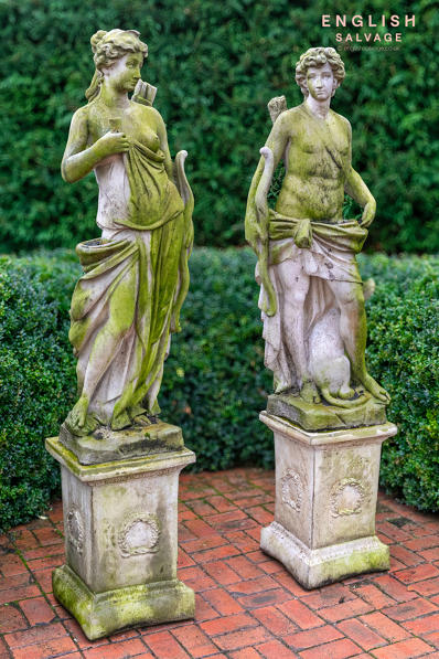 Weathered Diana and Orion statues on plinths
