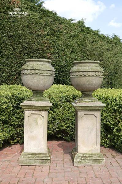Weathered hand-carved sandstone urns 