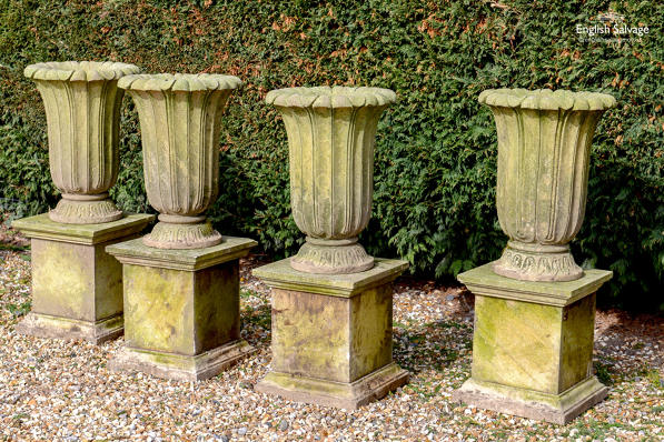Weathered stone trumpet urns (no plinths)