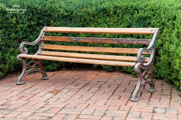 Weathered teak and cast iron garden bench
